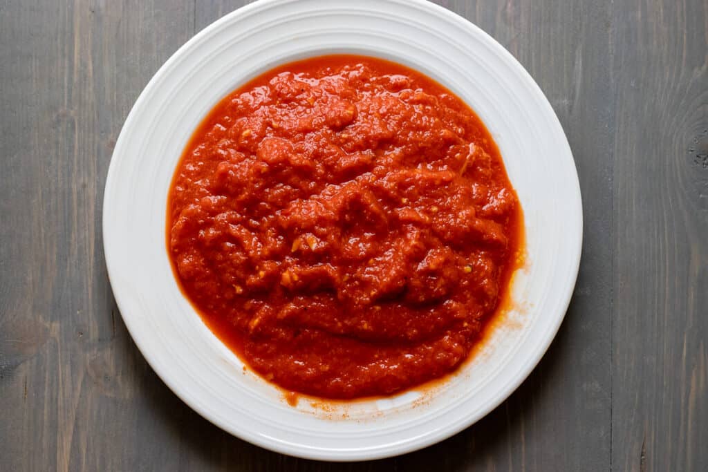 Roasted red peppers are blitzed until smooth.