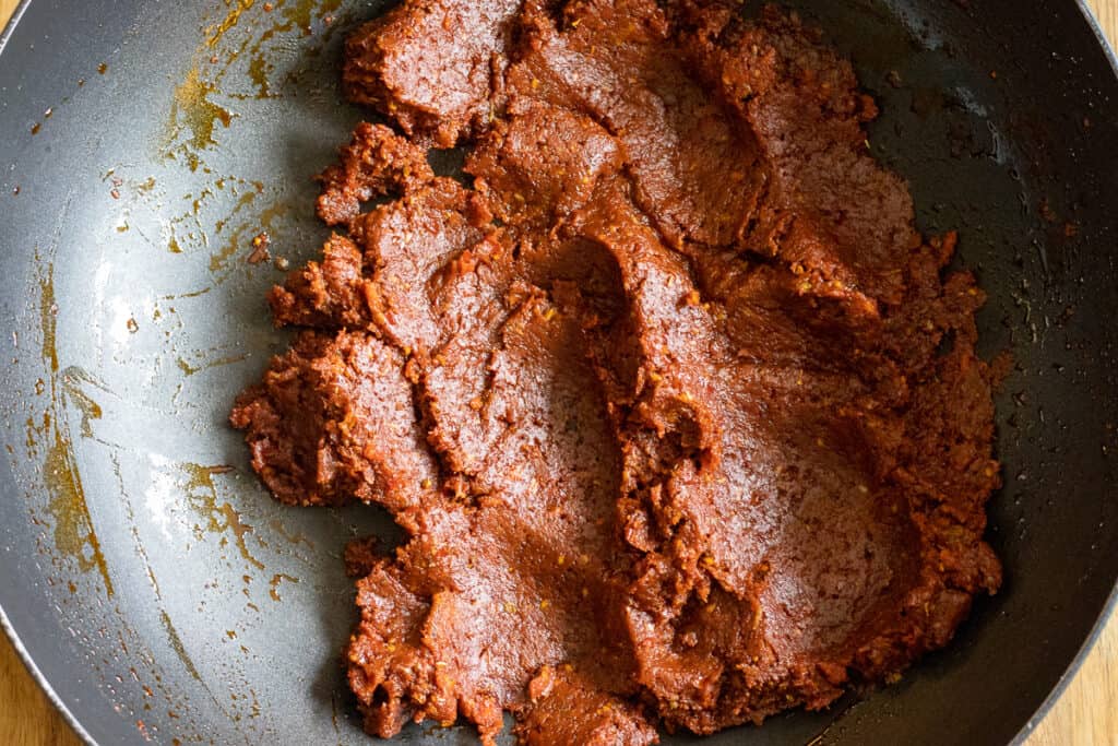 Ingredients are cooked together to create a smooth dip.