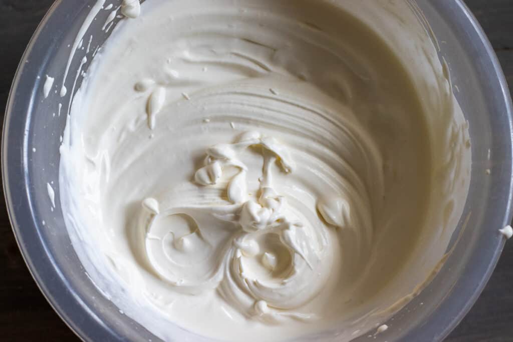 Cream whipped until it forms stiff peaks.