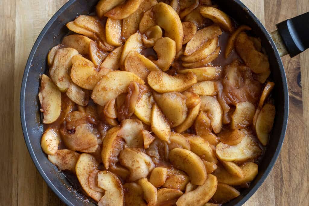 Apples are cooked until softened.