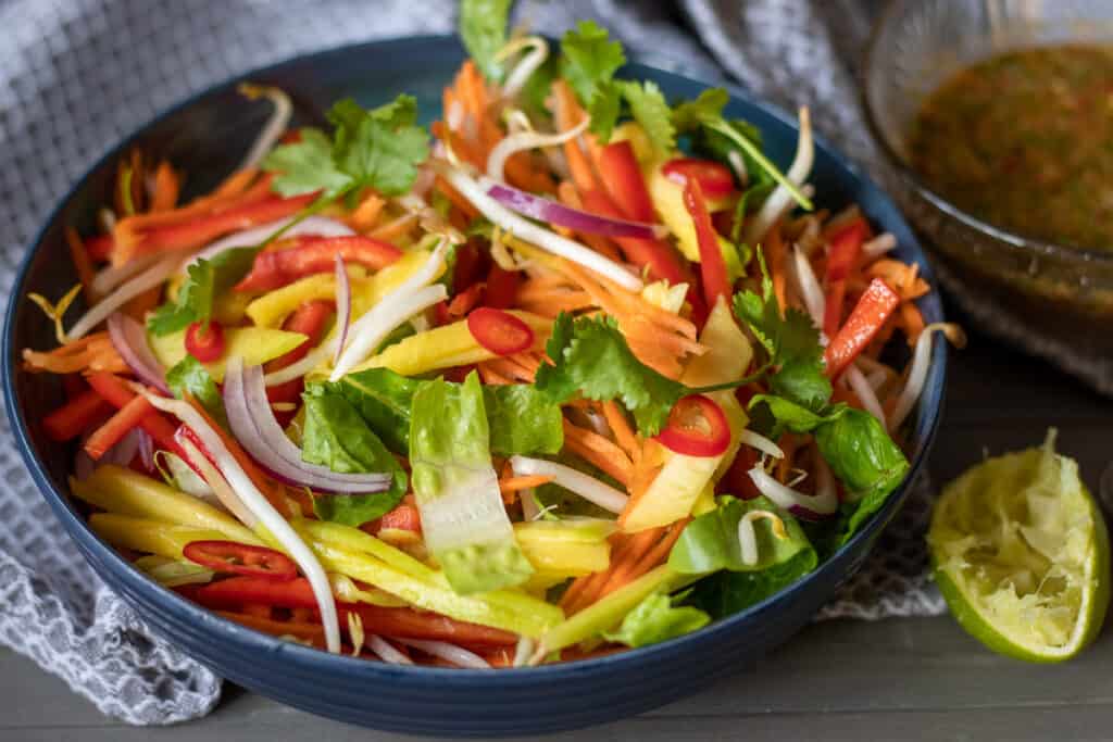 The salad served with the dressing on the side.