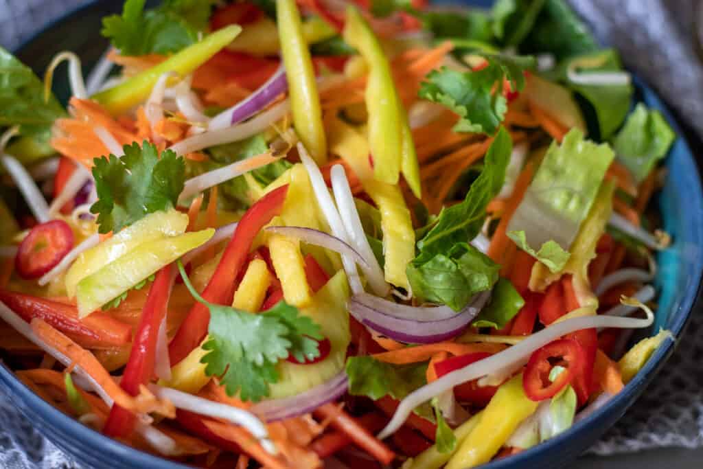 All the vegetables in a large salad bowl.