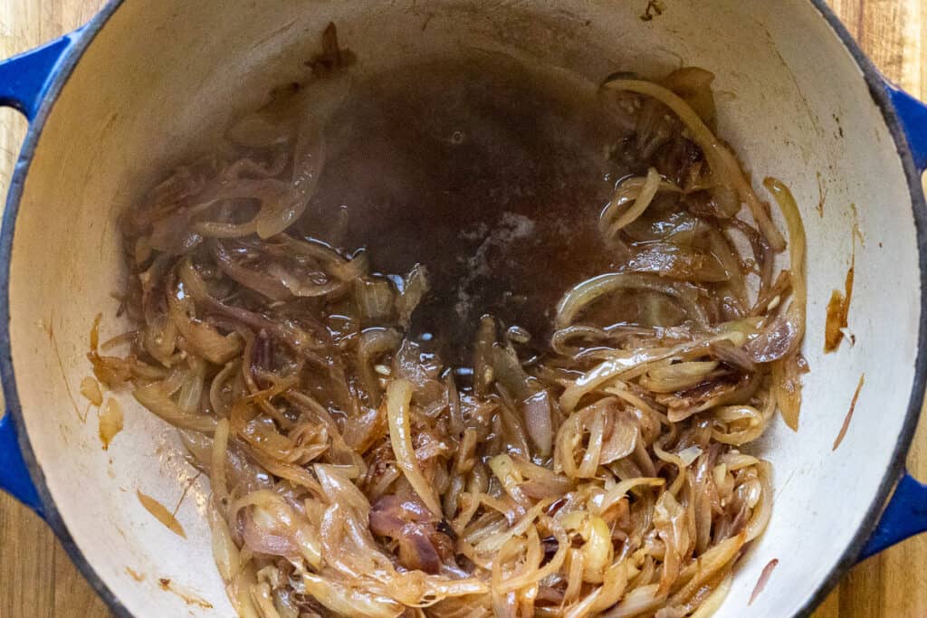 Vermouth added to the pot to deglaze the caramelized onions.