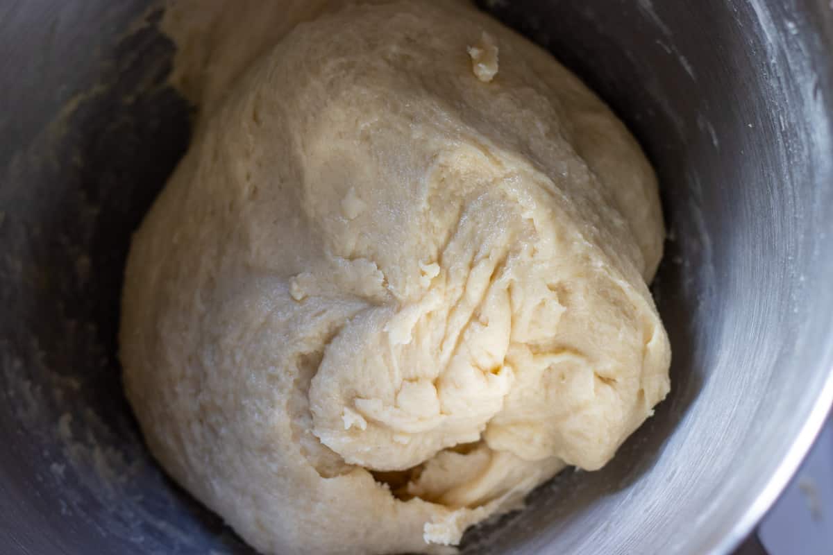 Softened butter is worked into the dough.