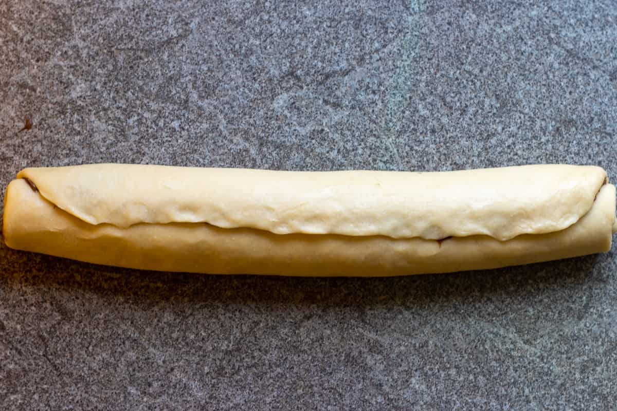 The dough rolled up into a log.