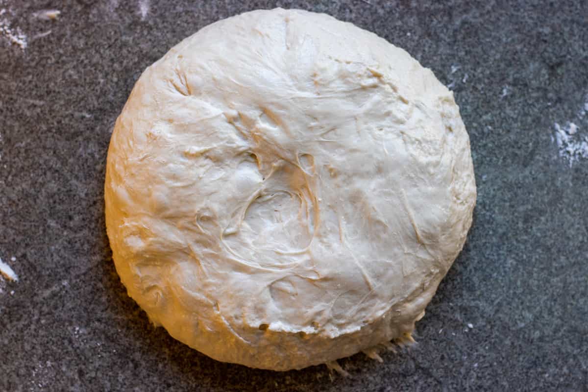 The dough is shaped into a ball.