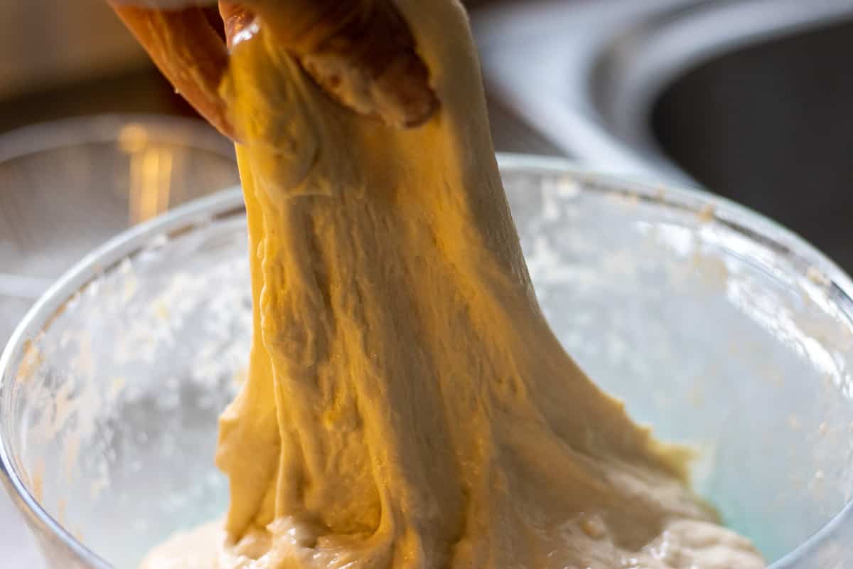 Pulling the dough to stretch.