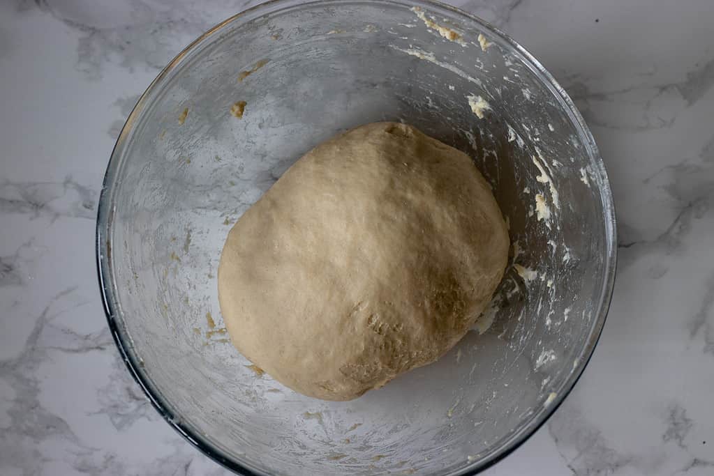 The dough is placed in a bowl for rising.