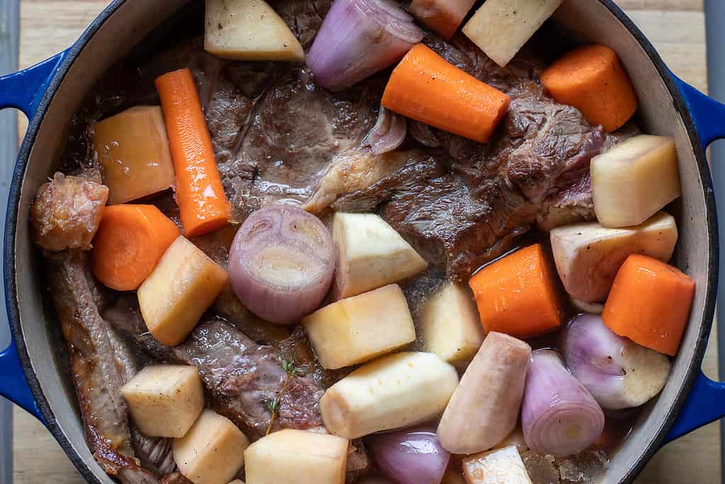 The stock is added to the Dutch oven.