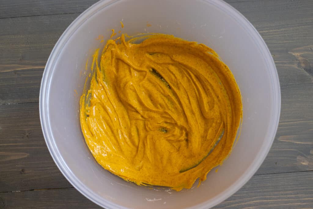 Yogurt, turmeric, garam masala and salt mixed for the marinade.