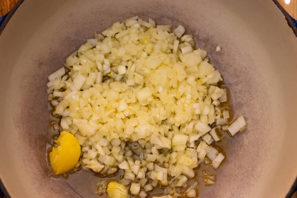 Diced onions frying in ghee until golden.
