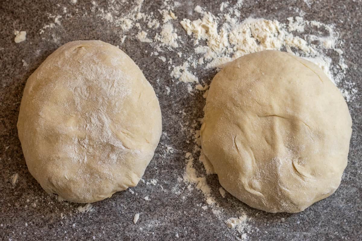 The bread dough is divided into two pieces.