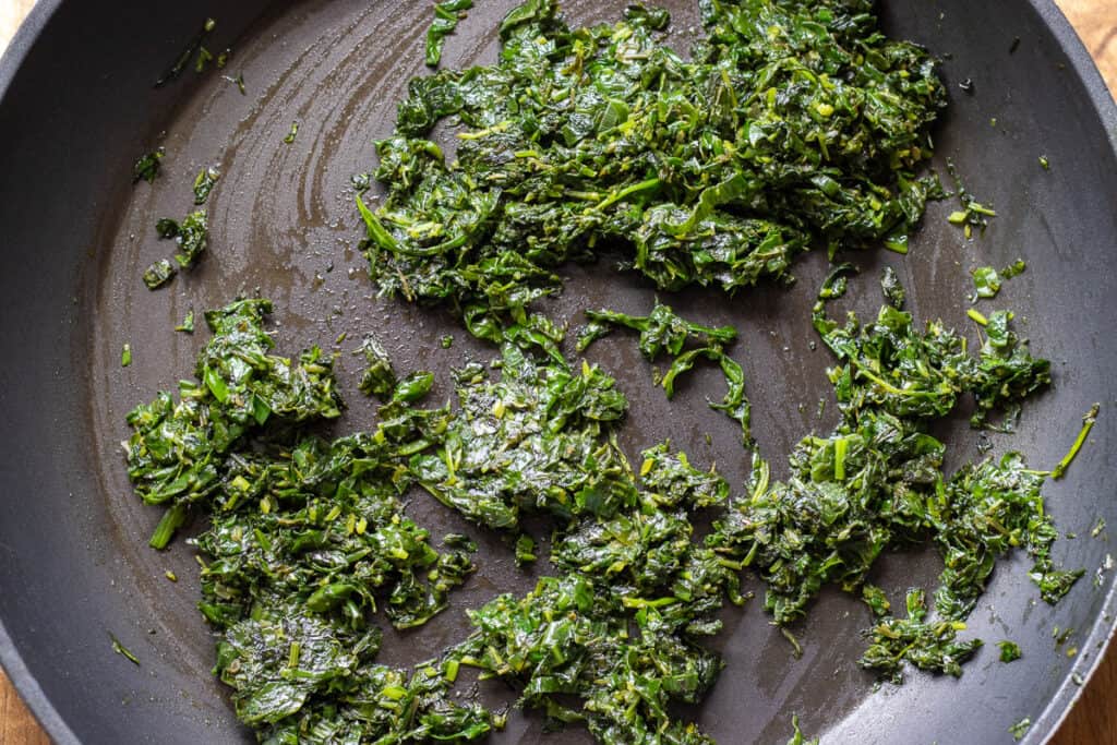 Chopped herbs fried until wilted.