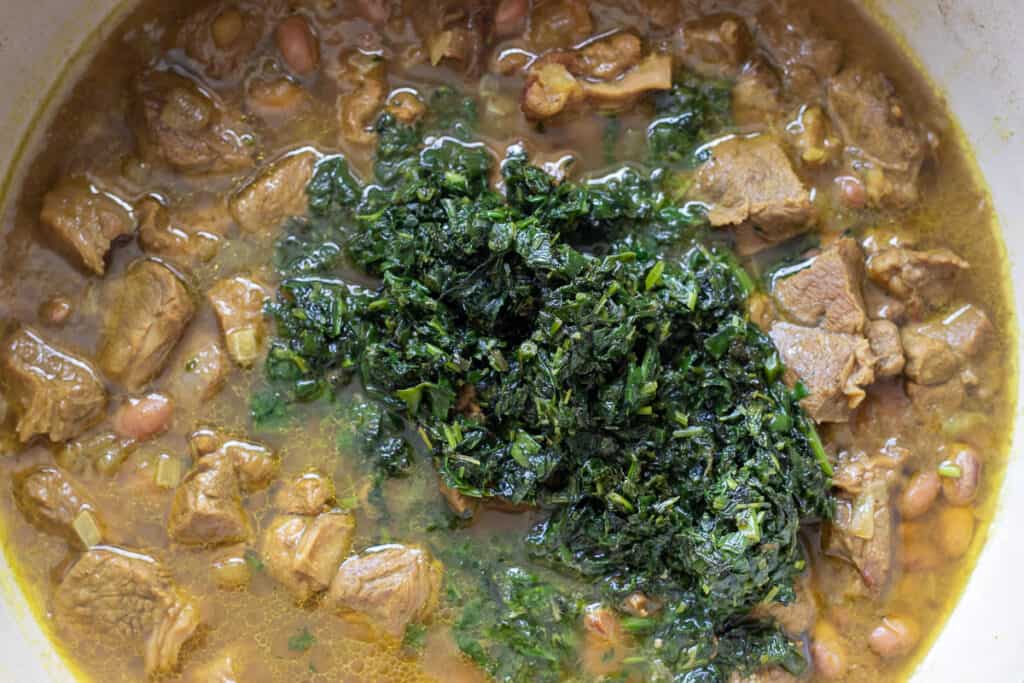 Fried herbs added to the stew.