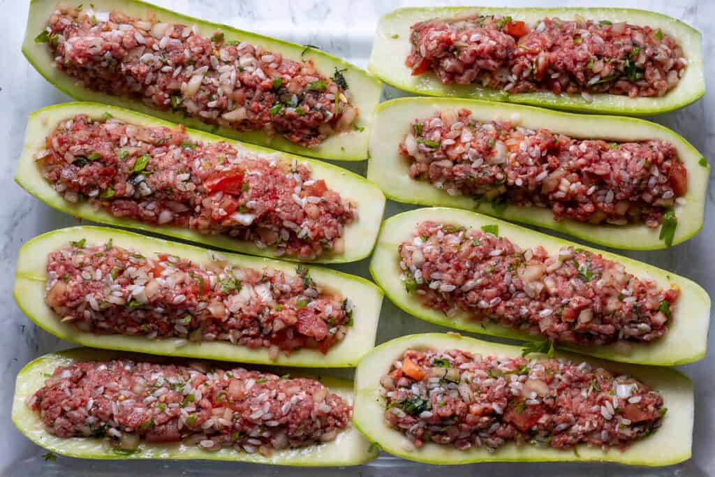 Zucchini boats filled with the ground beef and rice filling.