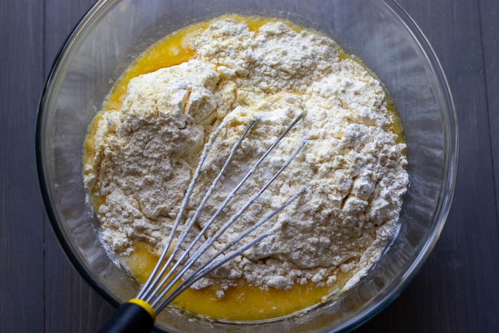 Dry ingredients being mixed into the wet ingredients.