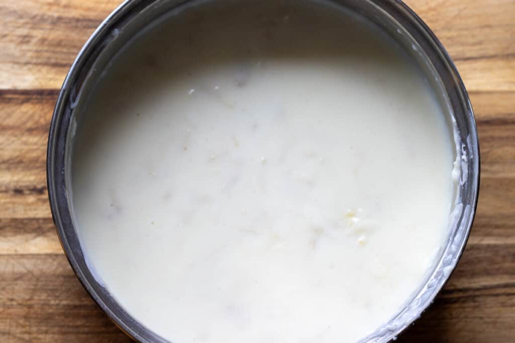 The custard stirred together with the shredded chicken.