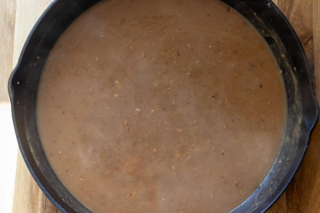 Chicken stock is added to the roux.