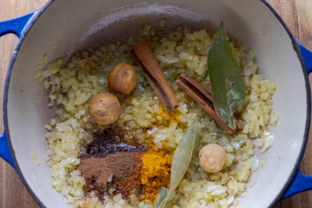 Spices are added to the browned onions.