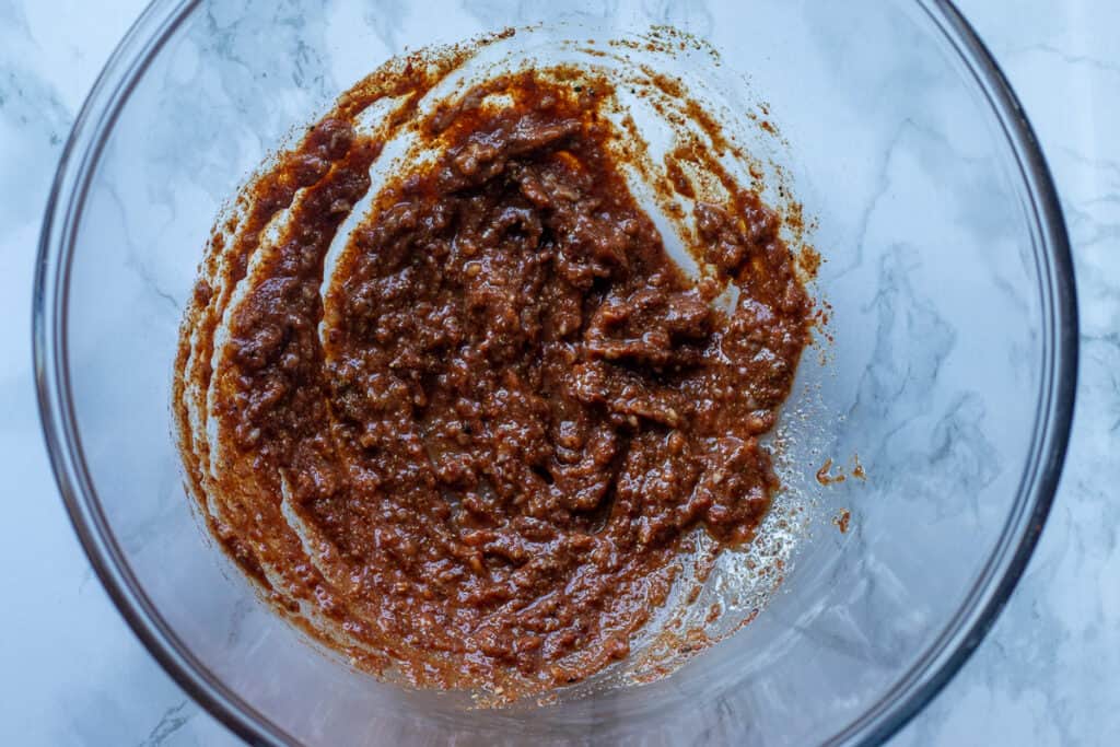 Ingredients for the marinade are mixed in a bowl.