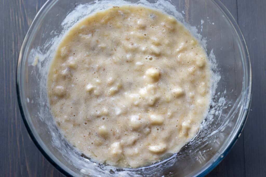 Wet ingredients are mixed in a bowl.