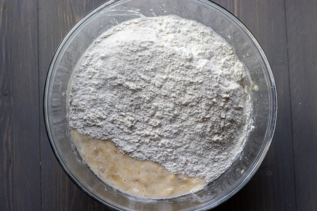 Dry ingredients are added to the wet ingredients.