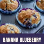 Banana blueberry muffins in blue paper cases in a muffin tin.