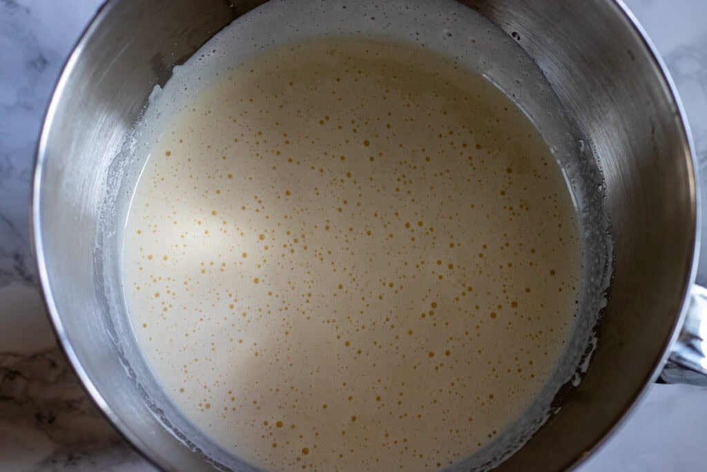 Oil and yogurt are added to beaten eggs.