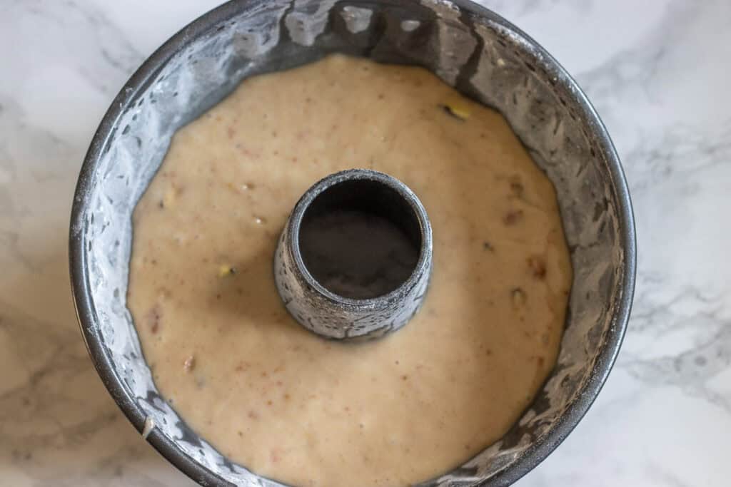 Fresh fig cake batter poured into a greased and floured 8-inch Bundt pan.