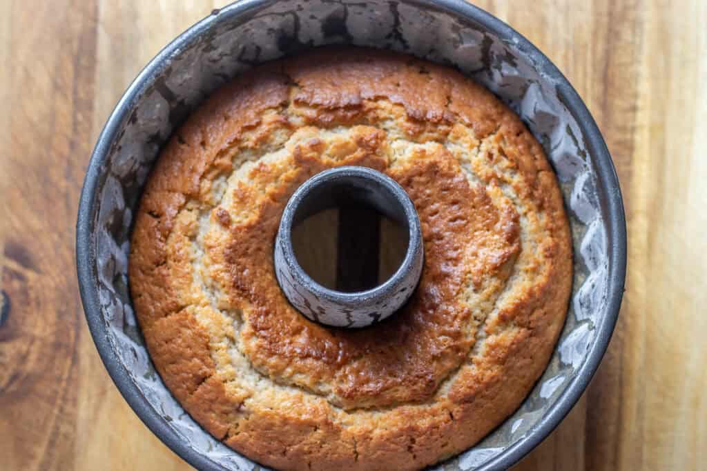 Golden fresh fig Bundt cake cooling after baking.