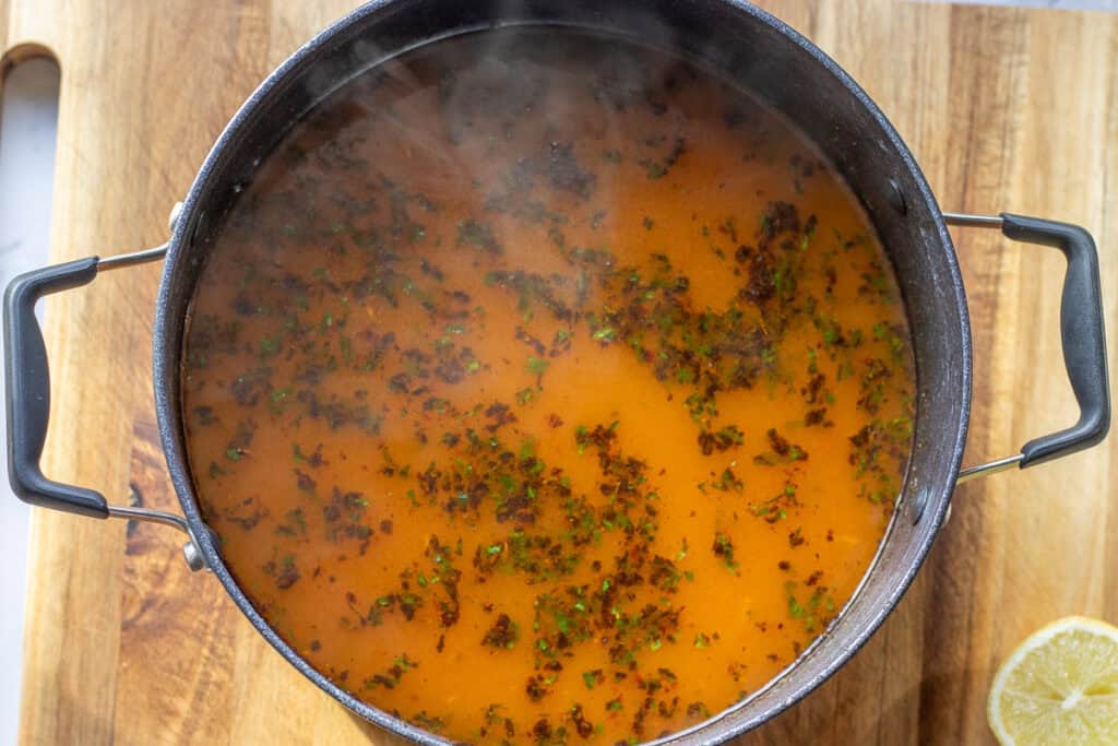 The soup simmered until the orzo is tender.