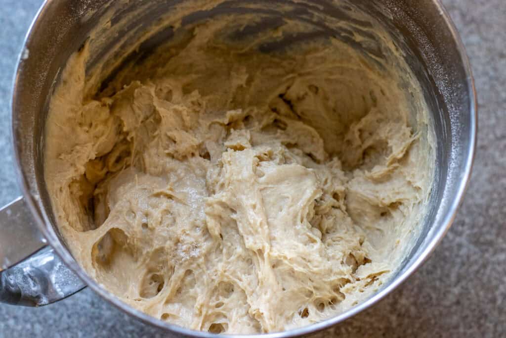 A soft and sticky dough is formed.