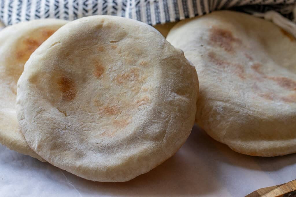 3 pieces of flatbread cooked in a hot oven.