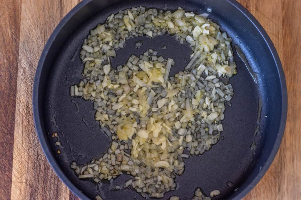 Shallot and garlic cooking in olive oil.