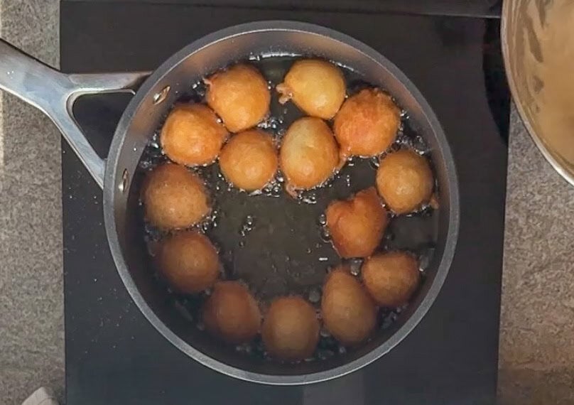 lokma dough balls are fried until golden brown