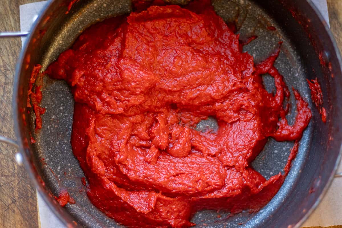 blitzed red peppers are cooked until it becomes a thick paste