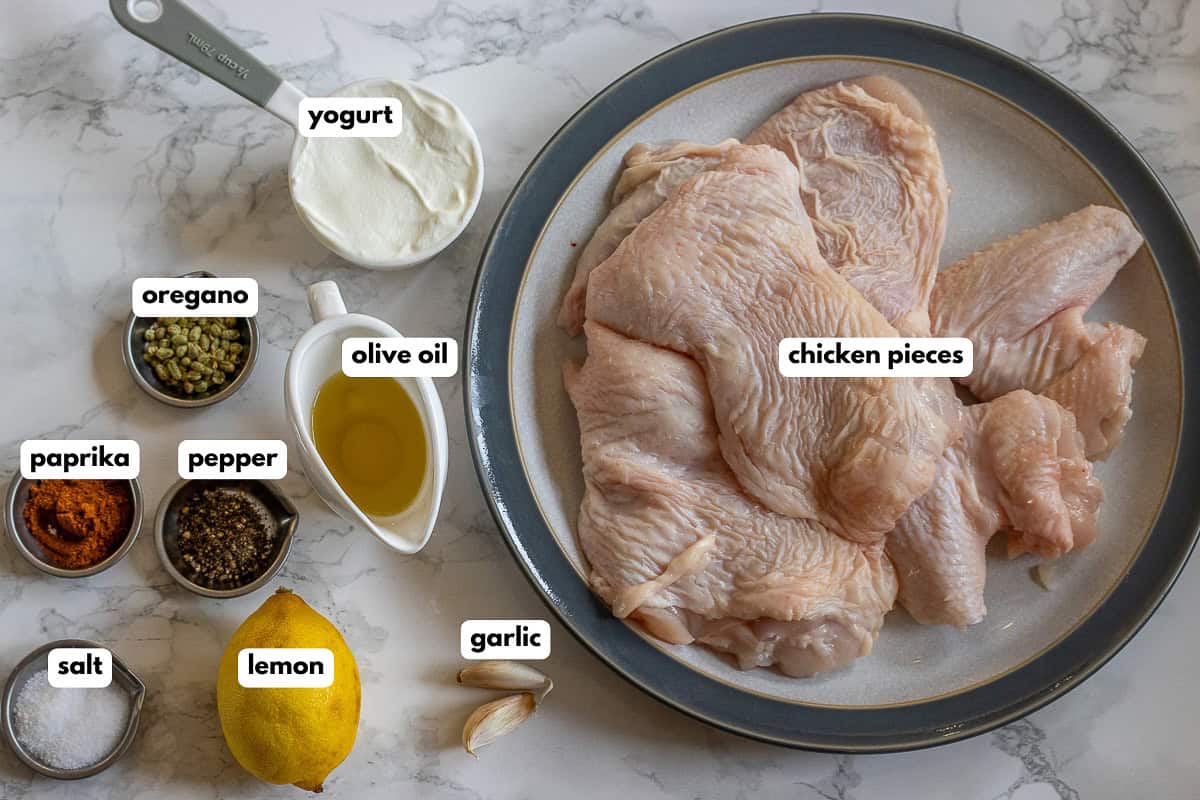 labelled picture of ingredients for easy greek chicken marinade wuith yogurt