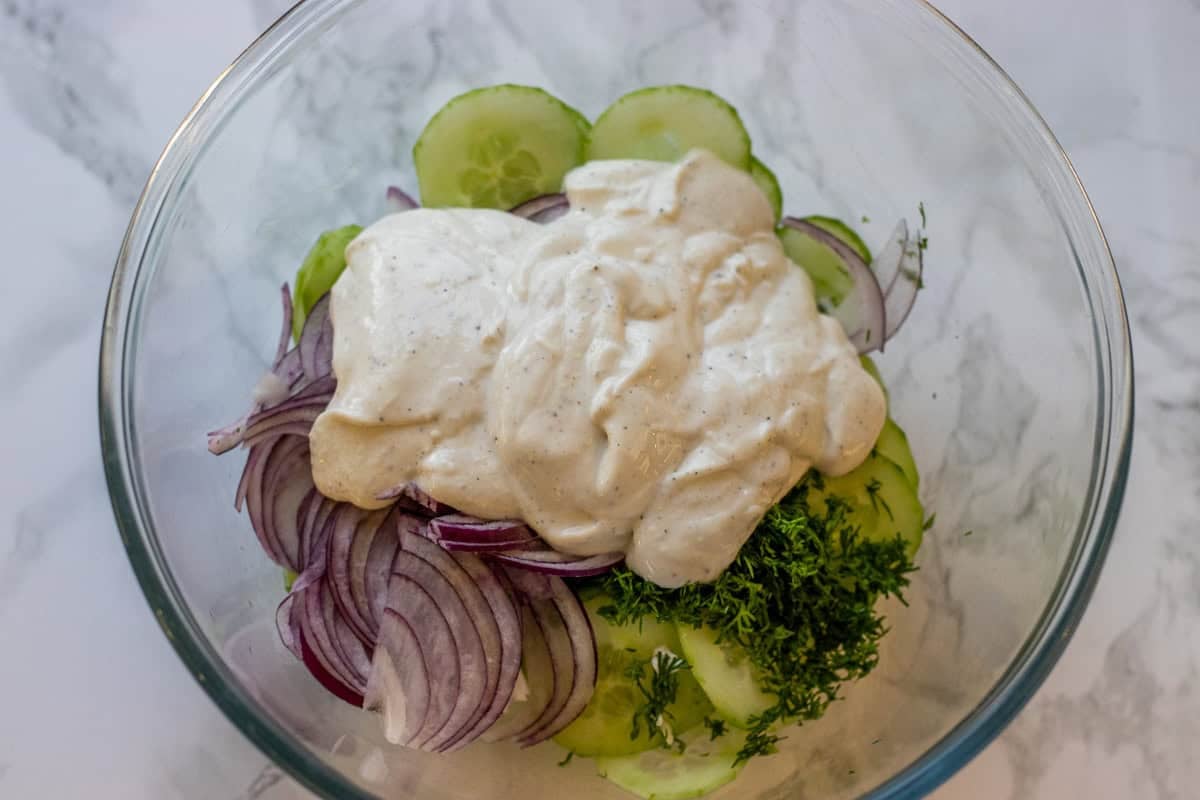 the dressing is added to sliced vegetables