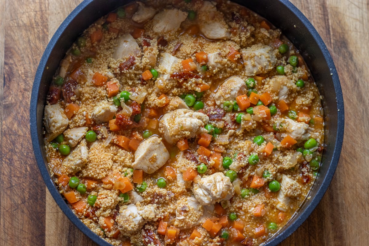 Chicken stock is added to the pan.
