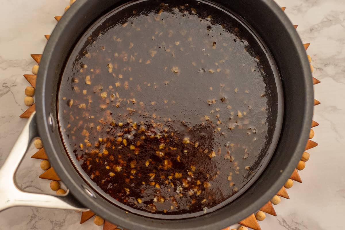 Honey sauce for coating crispy chicken pieces.