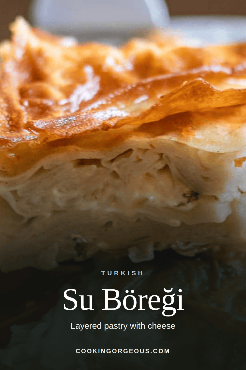 Su böreği, layered Turkish pastry with cheese, sliced on a plate.
