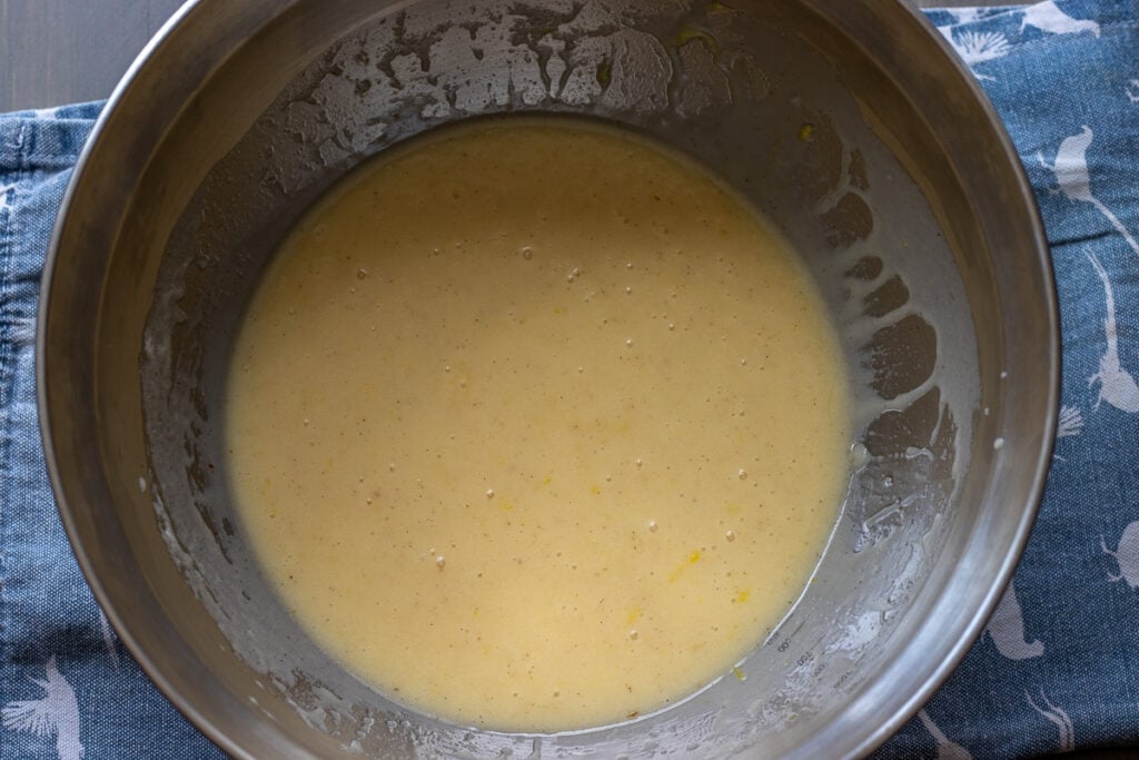 Whisked wet ingredients in a mixing bowl.