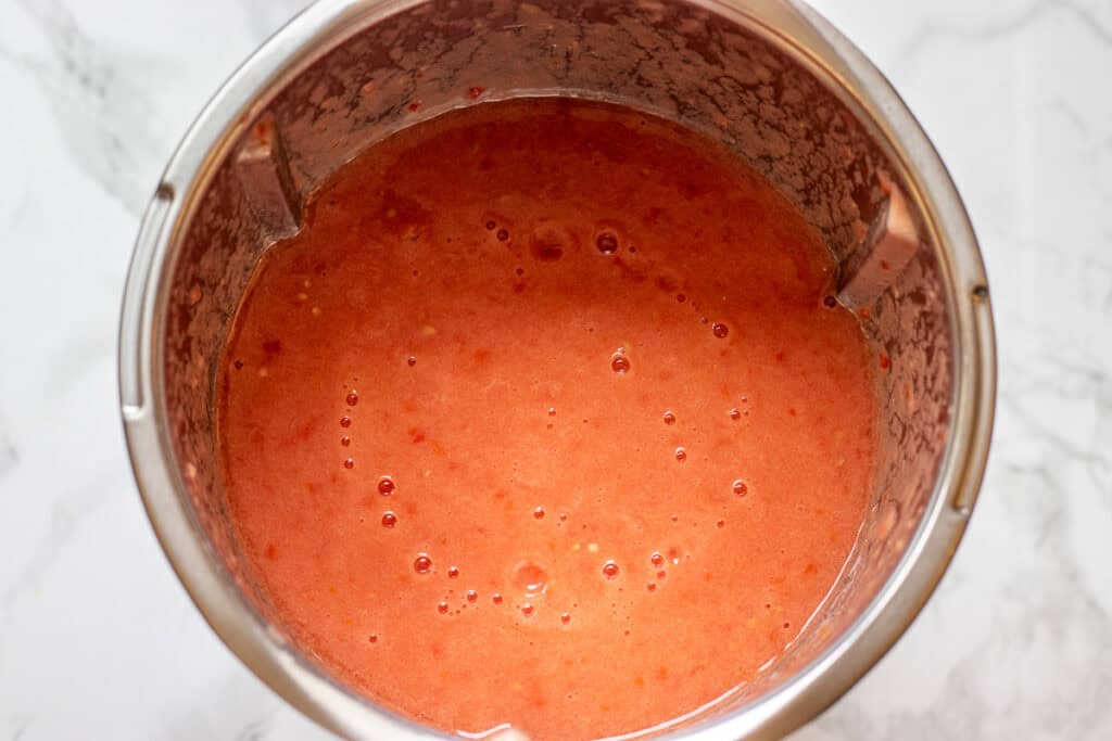 Raw tomatoes blended smooth in a powerful blender.