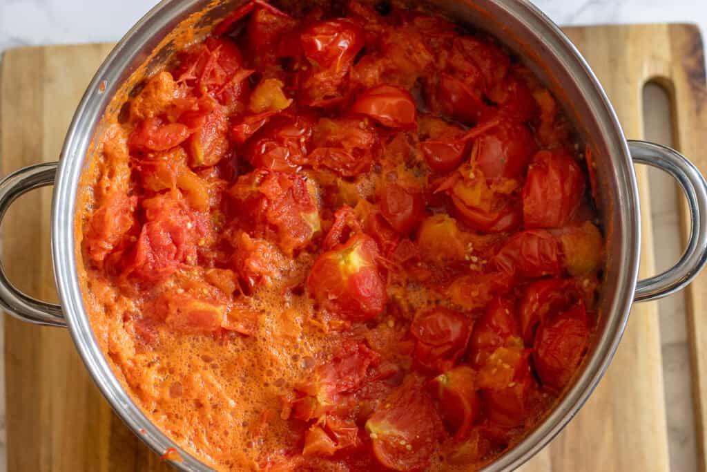 Boiled tomatoes softened in the pot.